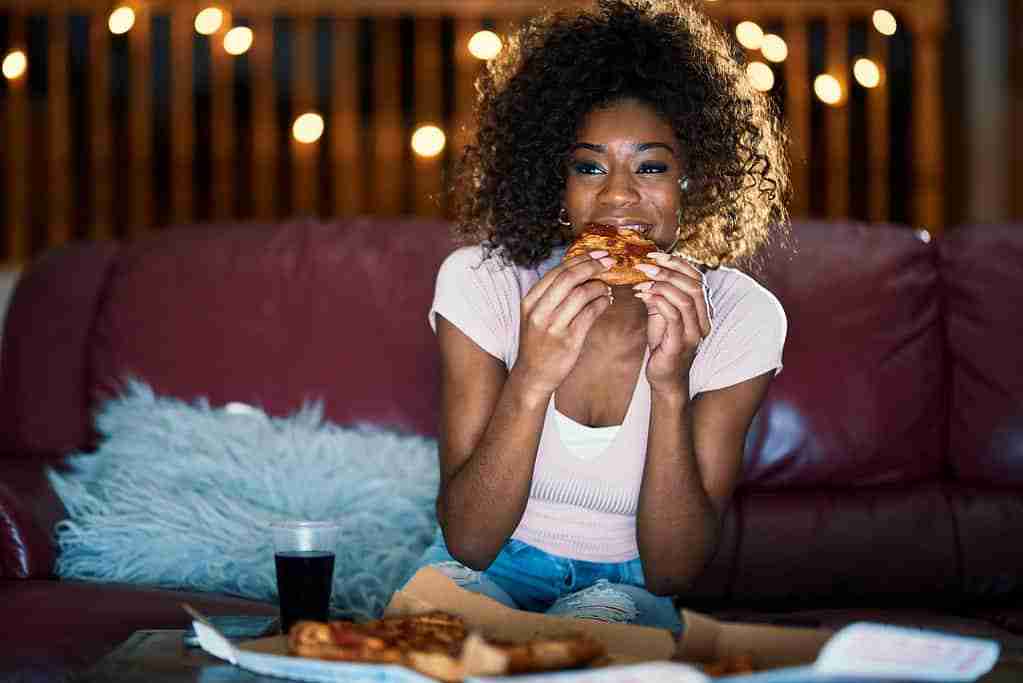 afro american girl eating pizza lcn blog firm