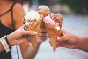 hands close up with gelato cones